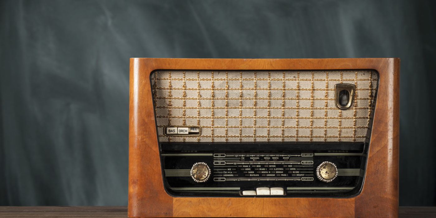 Old retro radio on wooden table